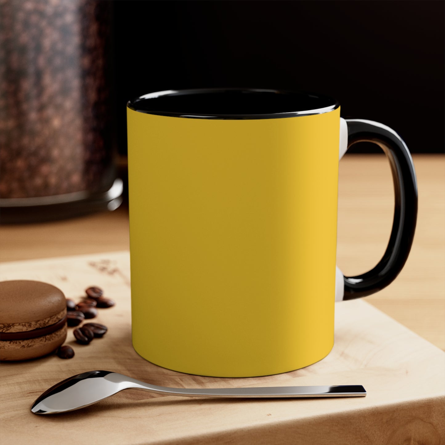 Yellow mug with a spoon